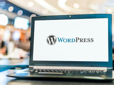 Laptop computer displaying logo of WordPress