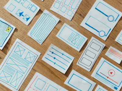 Top view of layouts of user experience design on wooden table