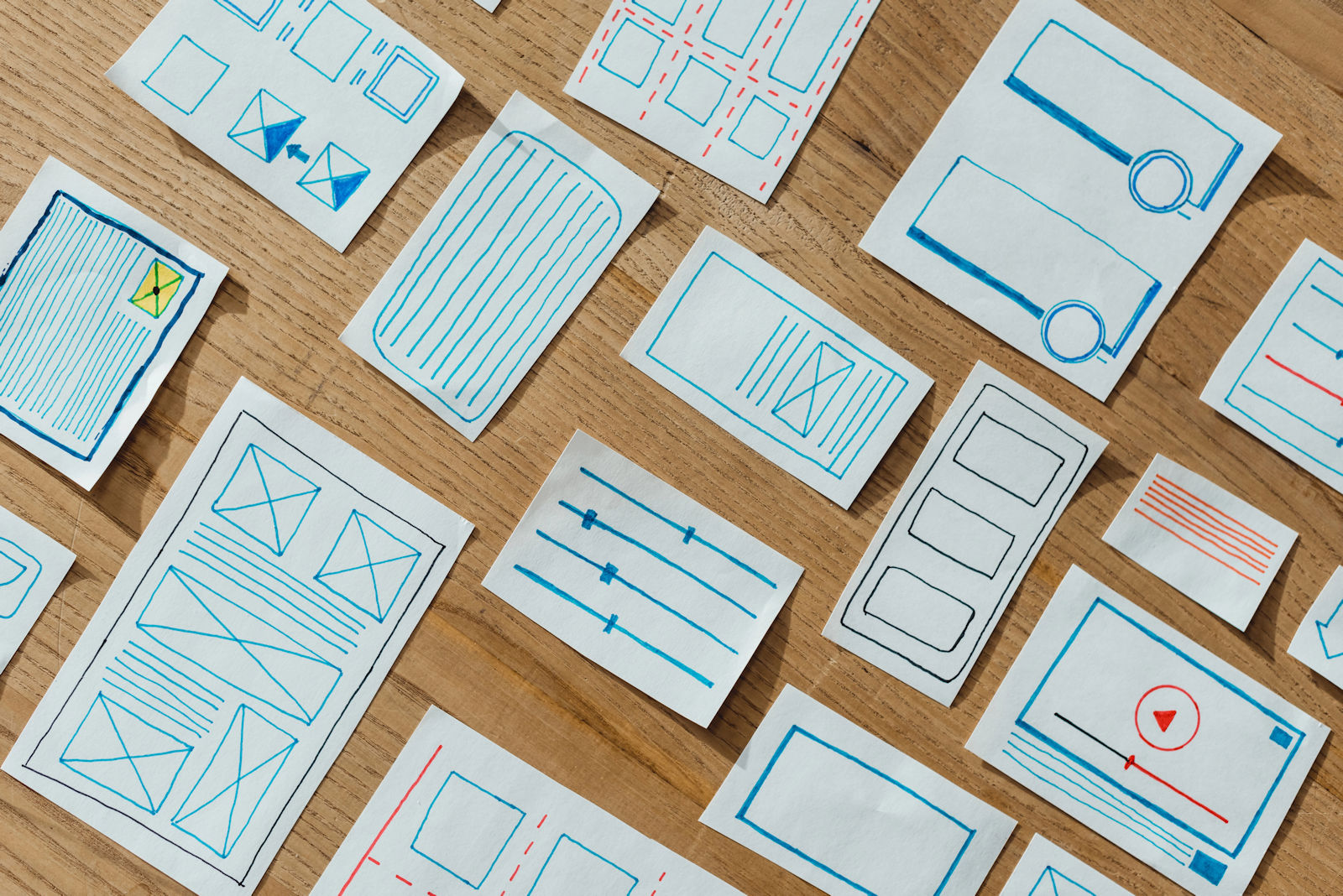 Top view of layouts of user experience design on wooden table