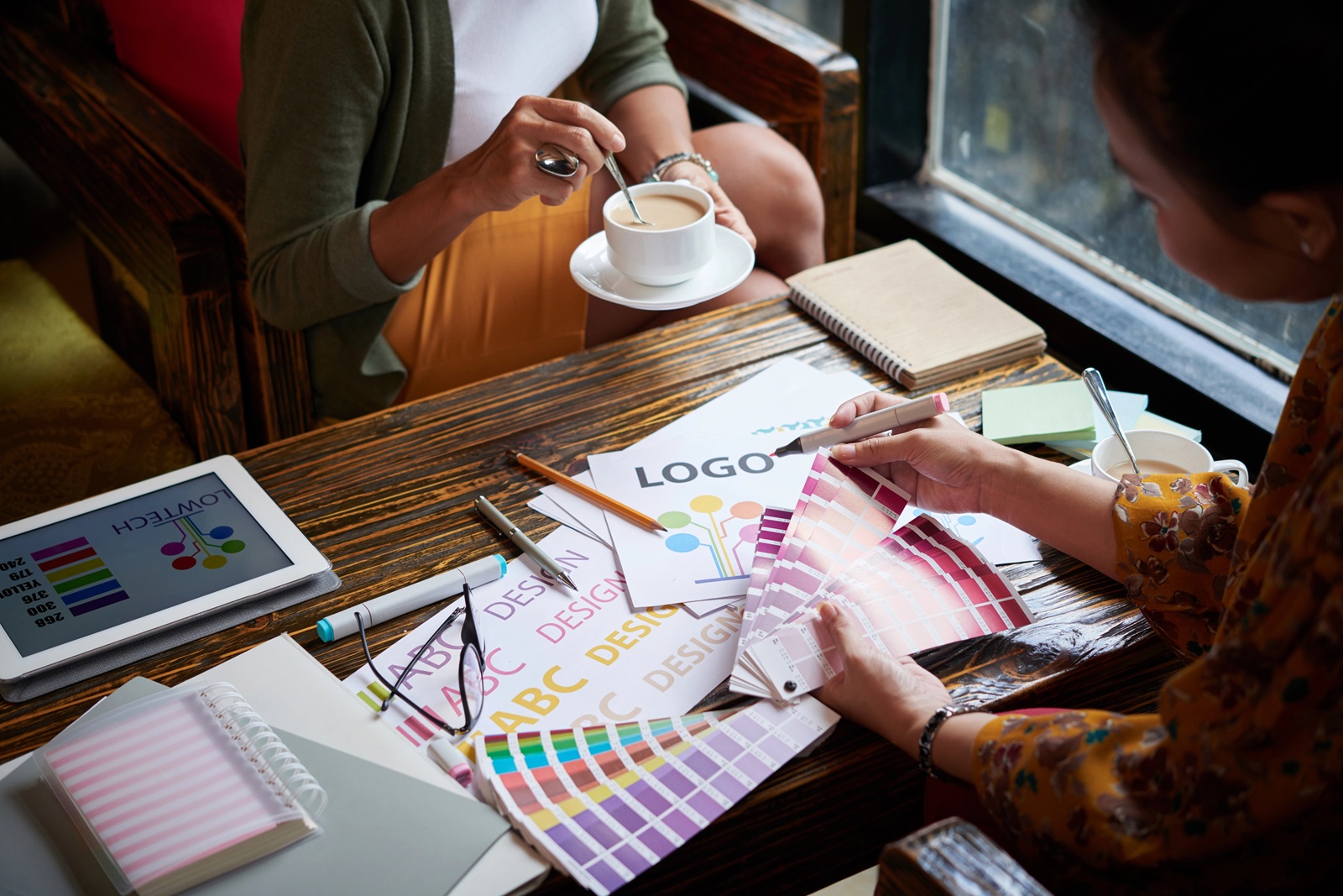 Designers working with color palette for brand