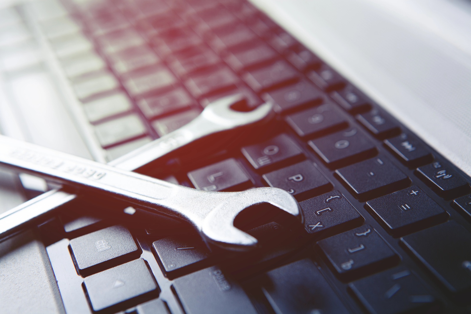 Wrenches on a computer keyboard