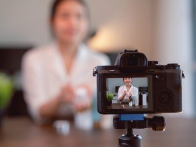 Asian female recording a marketing video