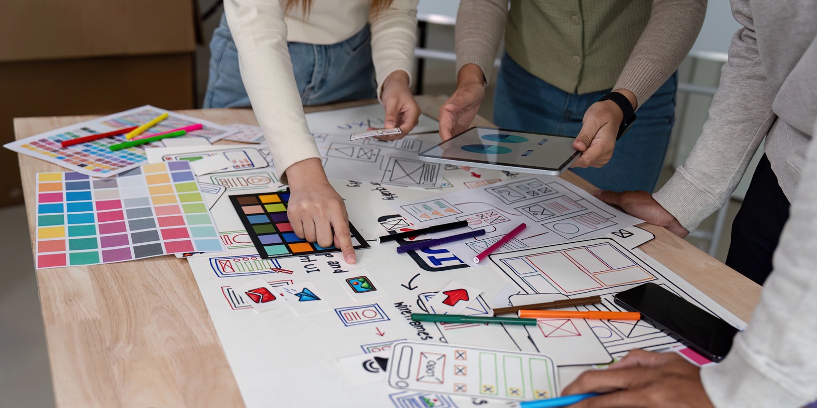 Team of creative web and graphic designer planning a website