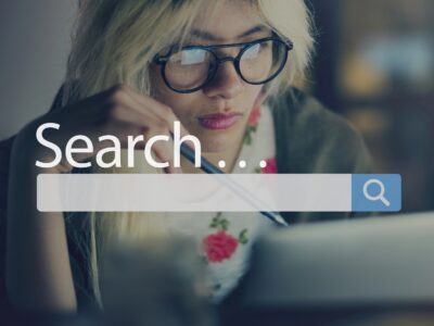 Woman searching online with search box overlay