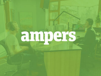 AMPERS logo overlaying on image of two men recording in a studio