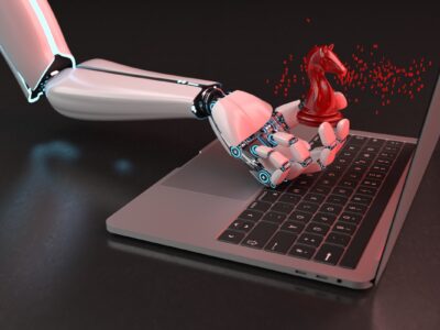 Robot hand with trojan horse and notebook on the dark background.