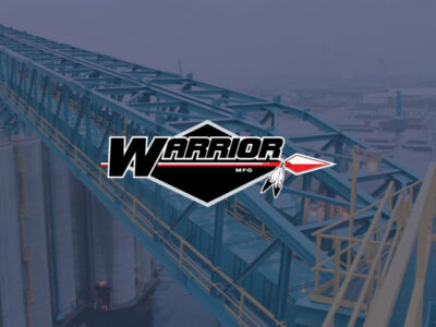 Warrior Mfg. logo overlaying on image of custom steel bridge structure